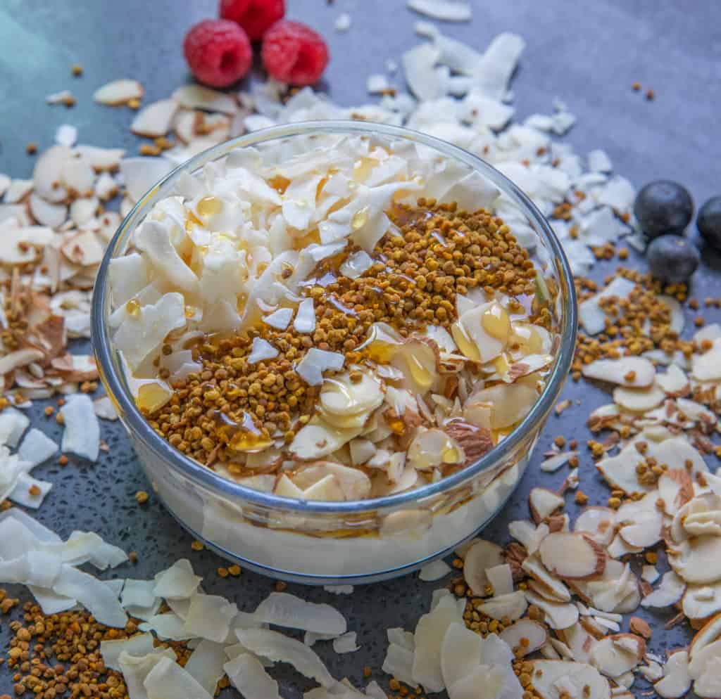 A bowl of yogurt with nuts, honey and bee pollen, HummingBee products