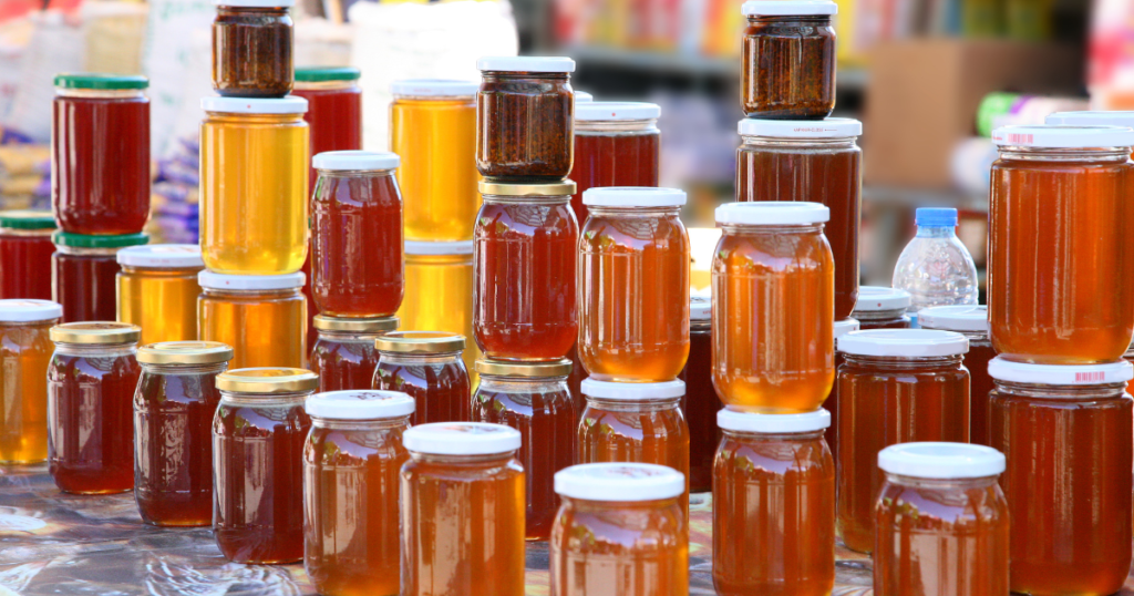 Different colors of honey on display